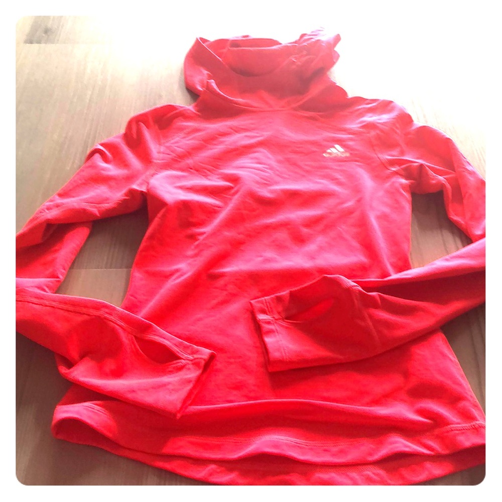 Bright orange adidas running top.